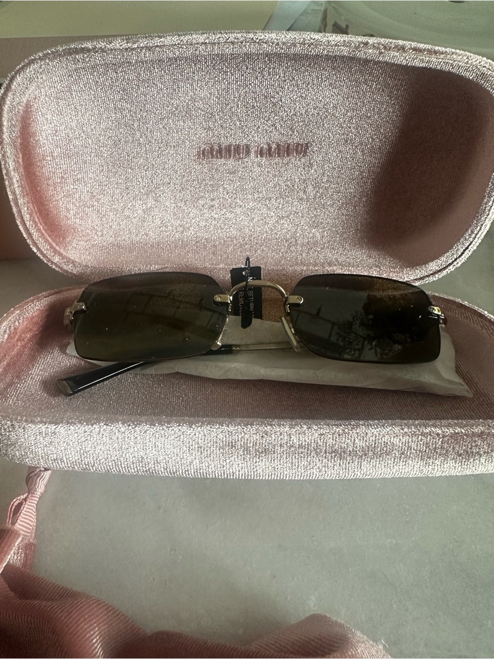 Miu Miu Black Sunglasses with Gold Logo Accent